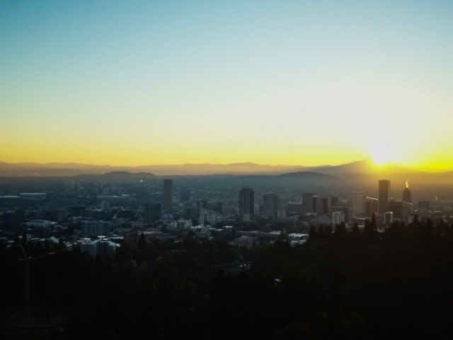 Sun rising over Portland from Washington Park